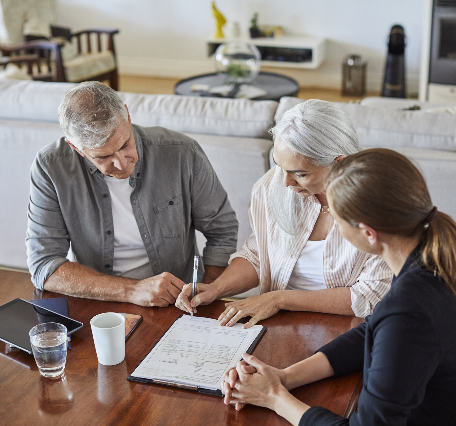 man and woman reviewing a contract with a professional