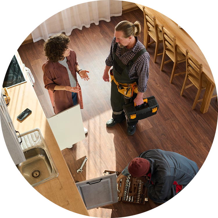 Workman speaking to family in their home