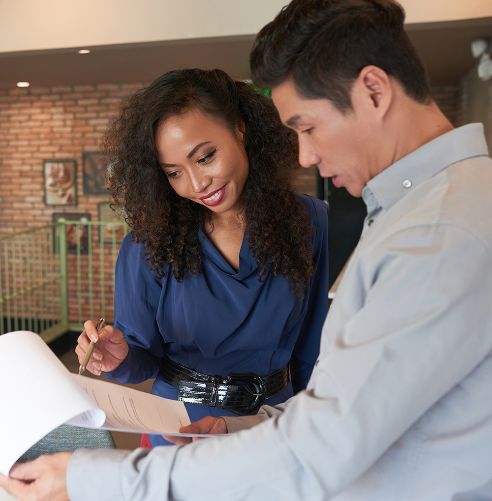 Man and woman reviewing a contract